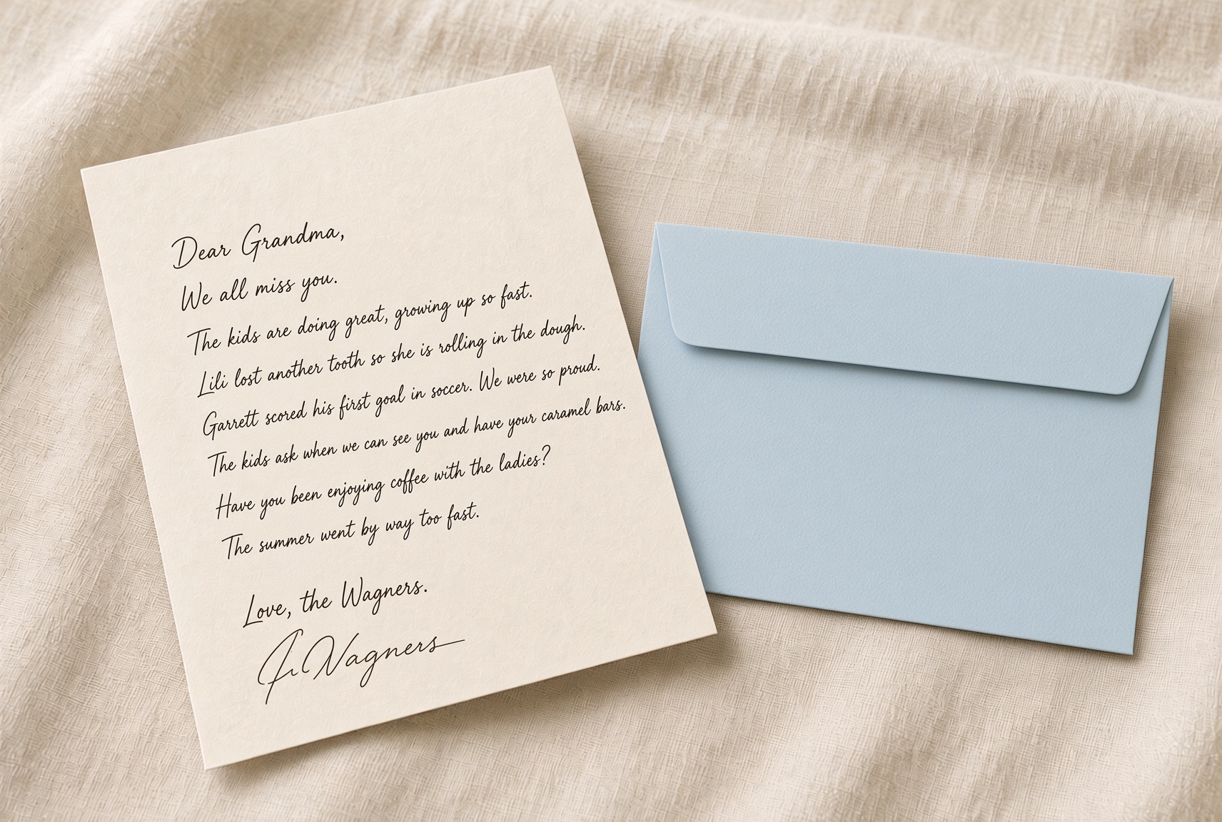 A cream letter beside a baby blue envelope